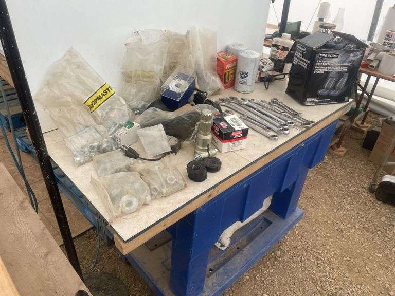 Quantity of misc tools, nuts and bolts, filters, pto adapter 540 to small 1000 etc.