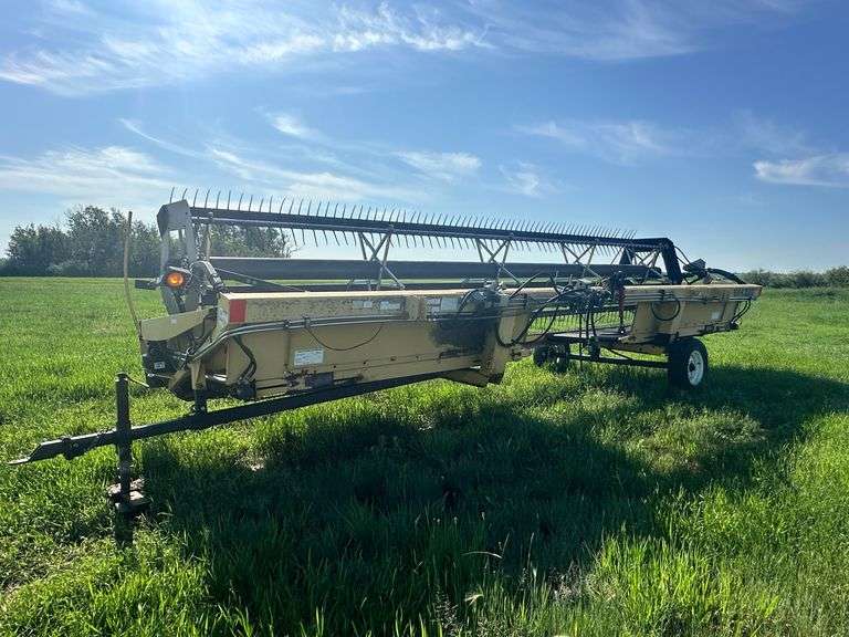 OFFSITE MELFORT: New Holland HW320 Haybine