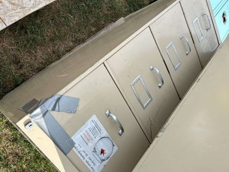 4 metal filing cabinets