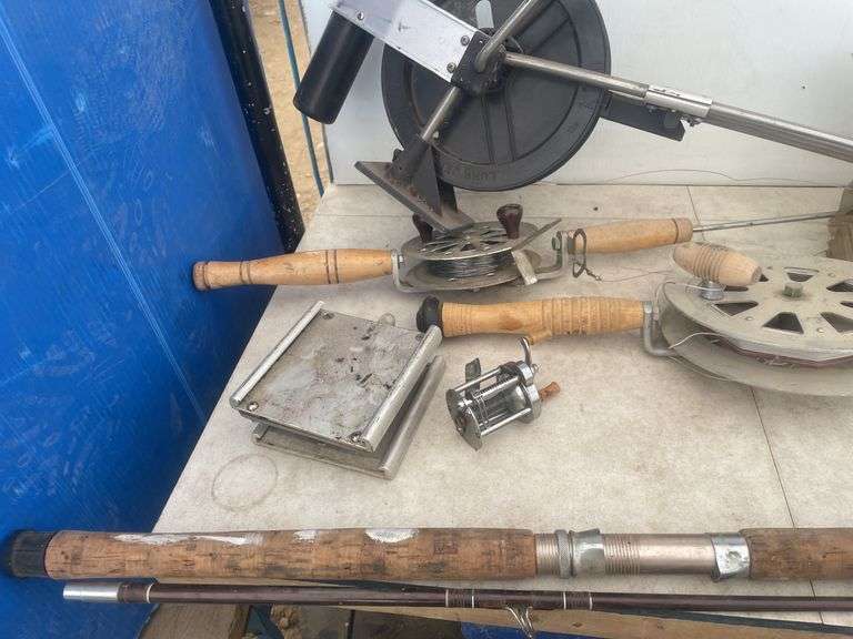Quantity of deep water fishing rods, 12V filleting knife, and an Eagle fish finder - condition unkno