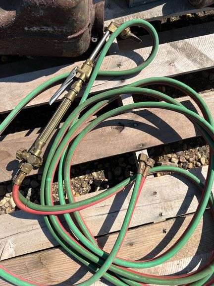 Pallet of misc, cutting torch, electric impact, mufflers etc
