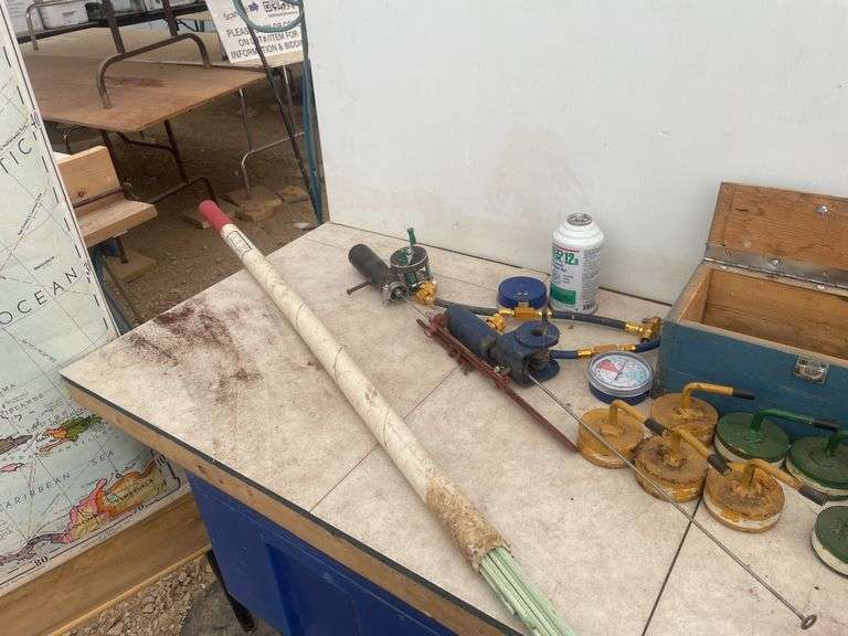 Set of homemade curling rocks, fishing rods, quantity of brazing rods has been exposed to moisture,1