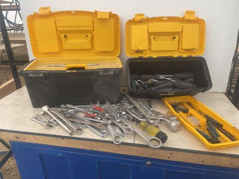 Pair of plastic tool boxes comes with a quantity of combination wrenches and screw drivers