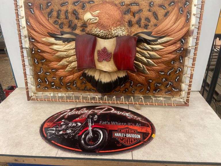 36" x 23" metal picture that lights up and a 22" oval Harley Davidson metal plaque