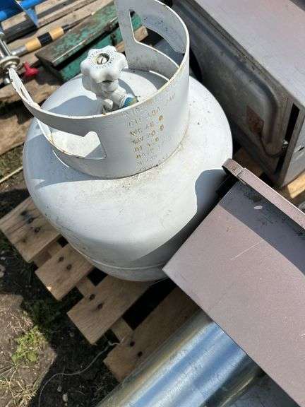 Pallet of misc, propane tank, shovel, wall heaters etc