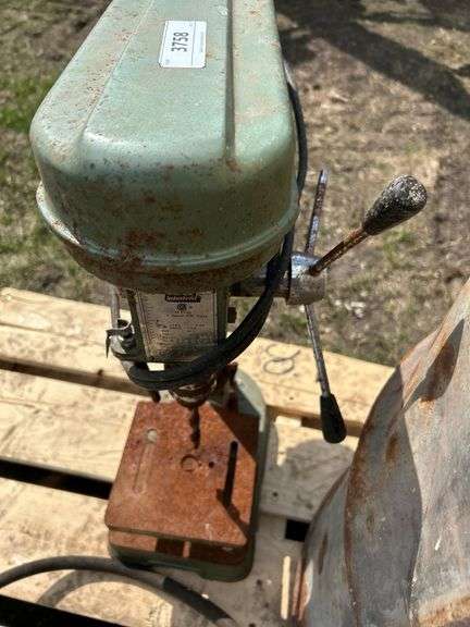Pallet of misc, barrel, rusty bench drill press, trap etc