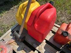 Pallet with gas cans, post maul, chainsaw - condition unknown