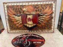 36" x 23" metal picture that lights up and a 22" oval Harley Davidson metal plaque