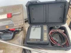 Quantity of deep water fishing rods, 12V filleting knife, and an Eagle fish finder - condition unkno