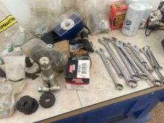Quantity of misc tools, nuts and bolts, filters, pto adapter 540 to small 1000 etc.