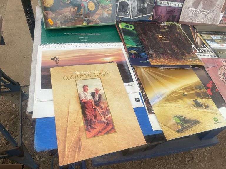 Quantity of John Deere and misc. calendars, misc journals and 1000 piece jigsaw puzzle