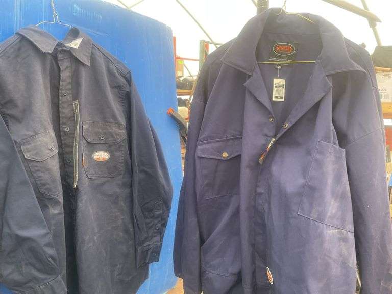 2 Flame resistant shirts size medium and a pair of coveralls-54T