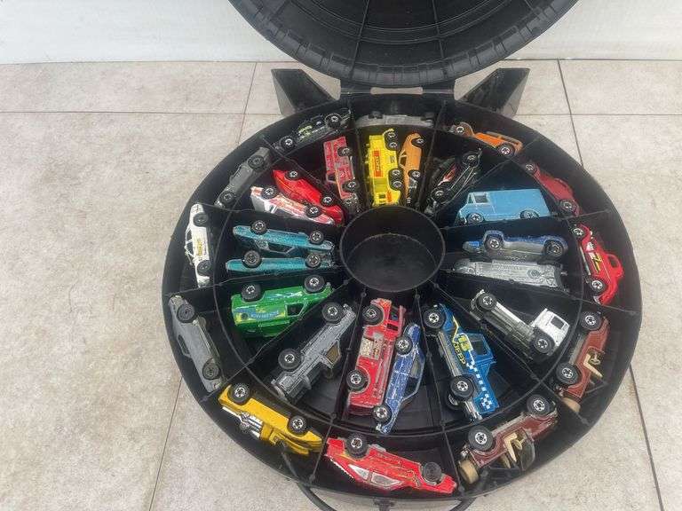 Quantity of diecast toys mostly hot wheels in case.