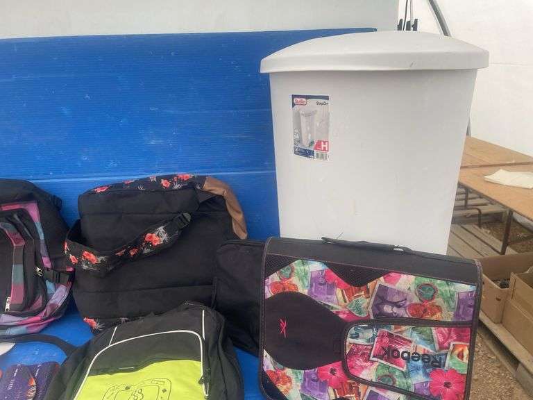 Quantity of hand bags comes with garbage can