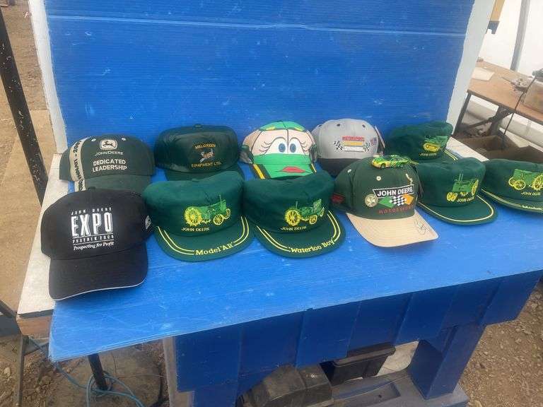 Quantity of John Deere caps included one that is autographed by " Chad Little " and car #97
