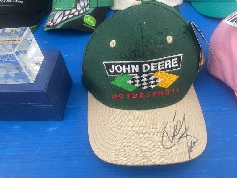 Quantity of John Deere caps including one that is autographed by "Chad Little", also paperweight and