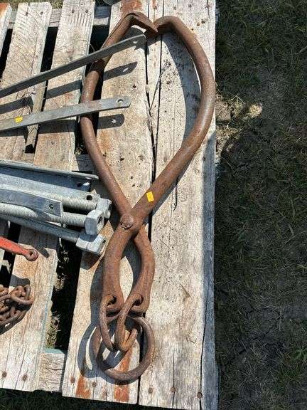 Pallet with logging chain, load binders , ice tongs etc
