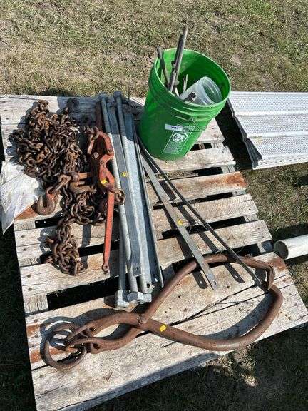 Pallet with logging chain, load binders , ice tongs etc