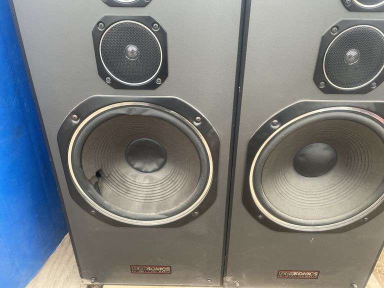 2 Techsonics speakers - one has damaged speaker cone - condition unknown - measure 32" H x 14" W x 1
