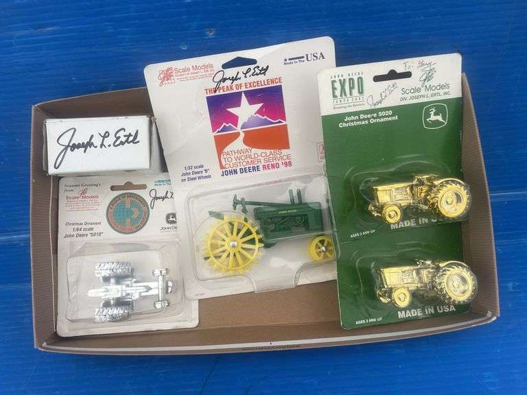 Quantity of ERTL 1:64 scale John Deere toys autographed by " Joseph Ertl "