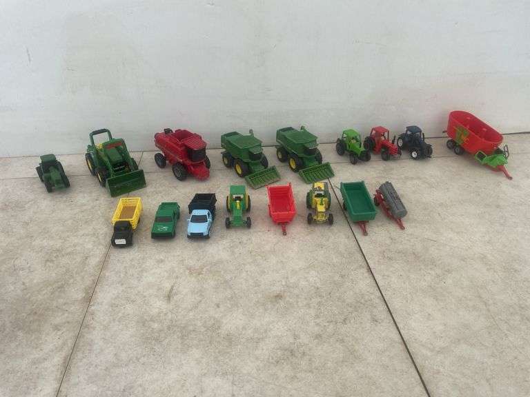A number of 1:64 scale toys including  Ertl  are John Deere combines and case combine etc