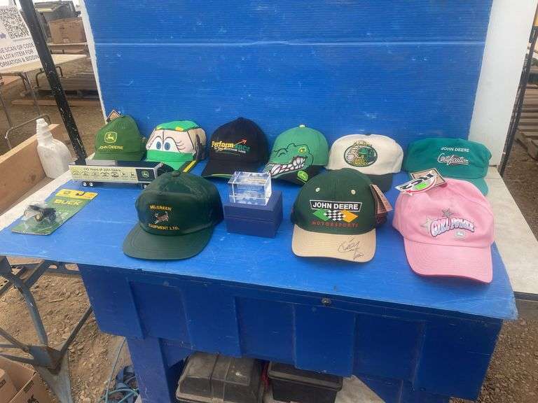 Quantity of John Deere caps including one that is autographed by "Chad Little", also paperweight and