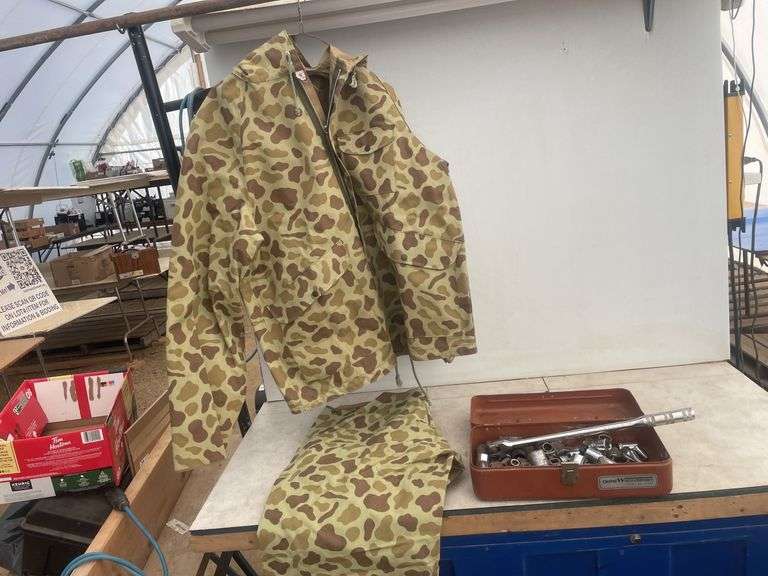 Rain suit size Small (34-36) and a quantity of misc sockets