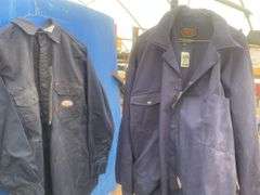 2 Flame resistant shirts size medium and a pair of coveralls-54T