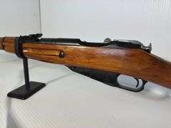 GUN: Believed to be 1946 6.5×52mm Carcano Model 38 rifle.