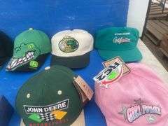 Quantity of John Deere caps including one that is autographed by "Chad Little", also paperweight and