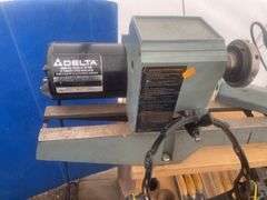 Delta 12" variable speed wood lathe, comes with tooling, face shield and sample bowls