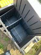 Pair of plastic storage boxes, snow shovel, folding sawhorses