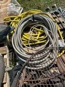 Pallet with golf clubs, garden hose, climbing spikes ets