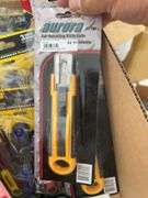 Qty of utility knives, qty of metal razor scrapers, pack of razor blades, qty of numbers, folding