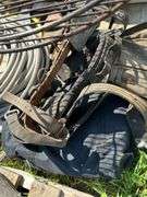 Pallet with golf clubs, garden hose, climbing spikes ets