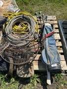 Pallet with golf clubs, garden hose, climbing spikes ets