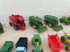 A number of 1:64 scale toys including  Ertl  are John Deere combines and case combine etc