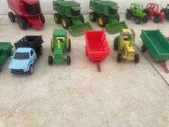 A number of 1:64 scale toys including  Ertl  are John Deere combines and case combine etc