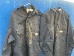 2 Flame resistant shirts size medium and a pair of coveralls-54T