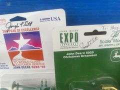 Quantity of ERTL 1:64 scale John Deere toys autographed by " Joseph Ertl "