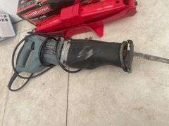 MotoMaster scissor jack, Vehicle Blackbox DVR, and a TradeSmith reciprating saw