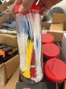 Qty of zip ties, hand sanitizer,hard hat mounted hearing muffs, bandaids, XL gloves, safety glasses 