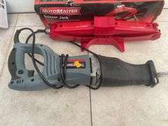MotoMaster scissor jack, Vehicle Blackbox DVR, and a TradeSmith reciprating saw