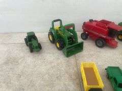 A number of 1:64 scale toys including  Ertl  are John Deere combines and case combine etc