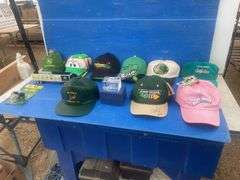 Quantity of John Deere caps including one that is autographed by "Chad Little", also paperweight and