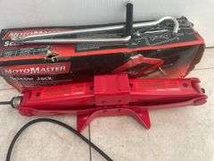 MotoMaster scissor jack, Vehicle Blackbox DVR, and a TradeSmith reciprating saw