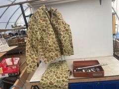 Rain suit size Small (34-36) and a quantity of misc sockets