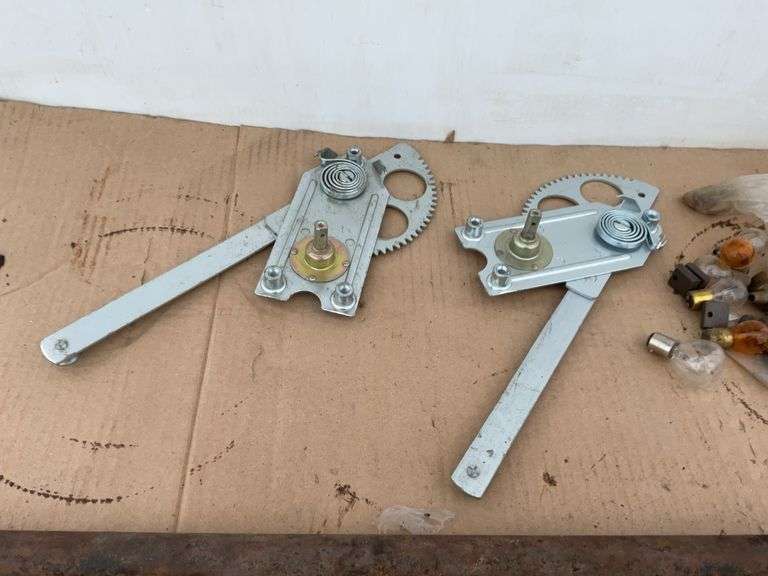Set of unused window cranks for Model T, Model T light bar, and miscellaneous lightbulbs and brushes