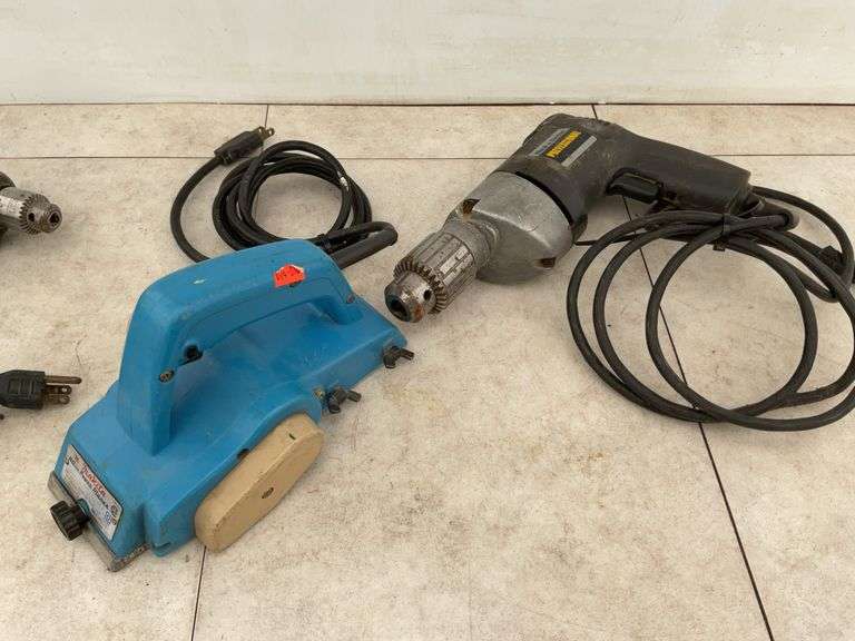 Running 1/4" Black & Decker and 1/2" drills, working Makita hand planer