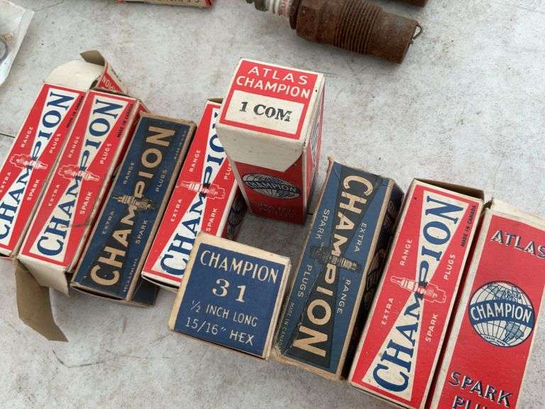 Quantity of new and used Champion spark plugs, quantity of brushes for Model T